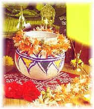 Pongal, known as Sweet rice, is cooked in a new earthenware pot